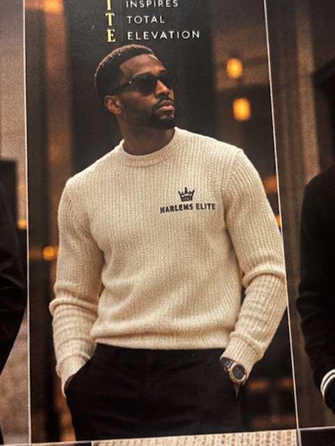 The Harlem's Elite ribbed crewneck worn with the crown mark on the chest